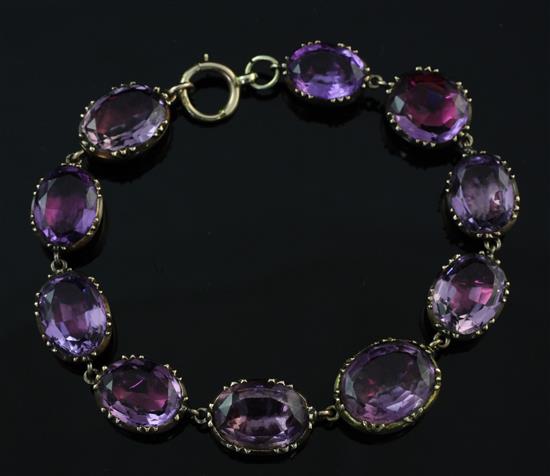 A 19th century 9ct gold and foil backed amethyst bracelet, length approximately 6.5in.